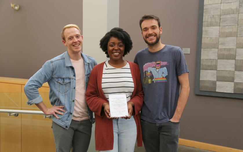 Three BME PhD students holding a certificate
