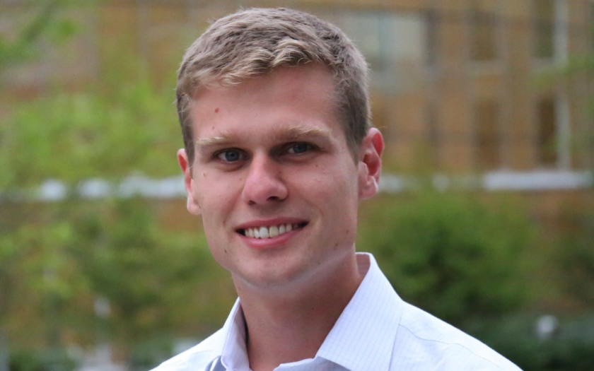 Adam Rago portrait on campus with a blurred background