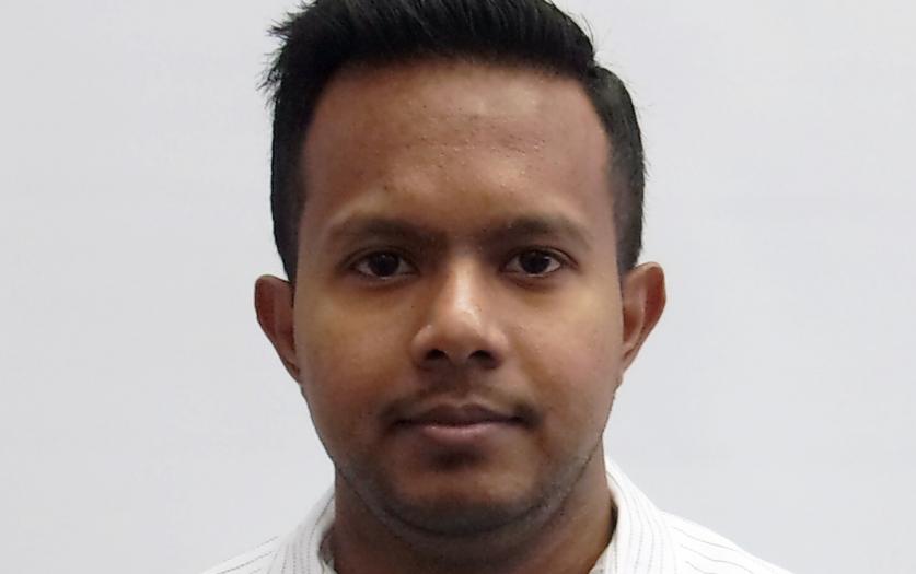 Harry Samaroo headshot on a gray background