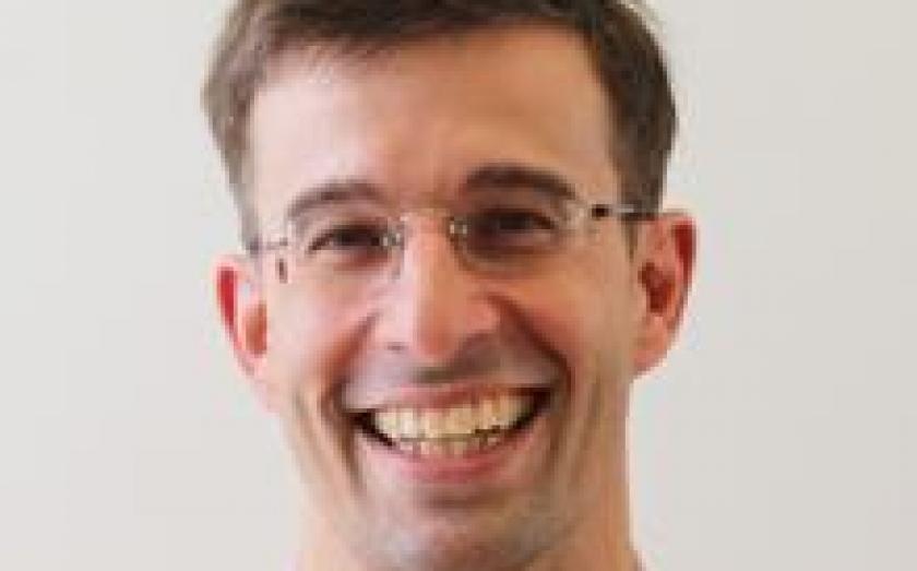Portrait of Mark Homer on a gray background