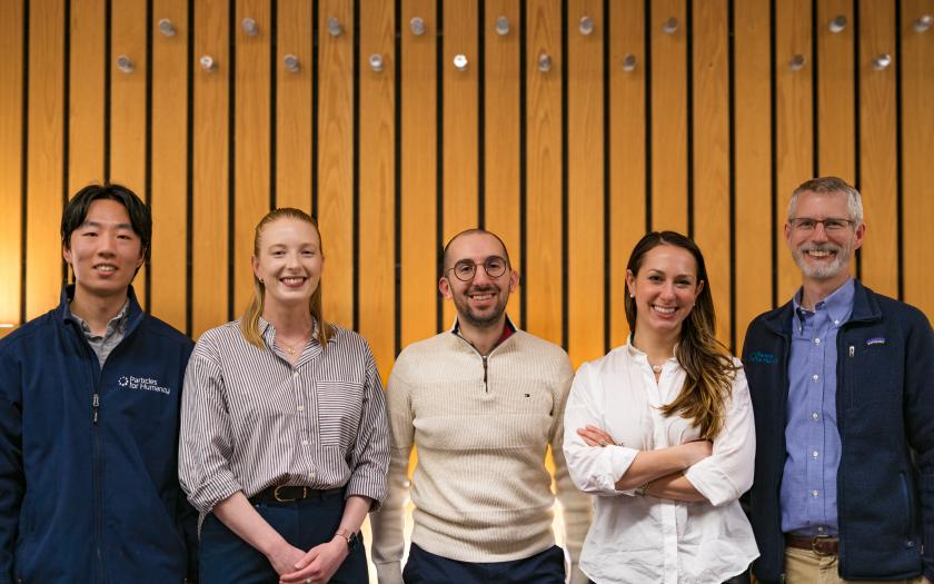 Panel members standing in a room