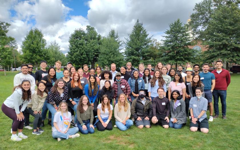 Graduate students posing in a field