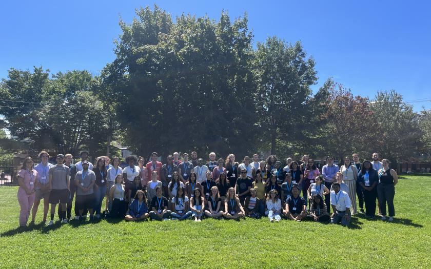 New graduate students group photo in a field