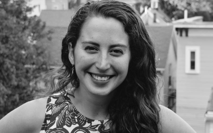Liza Gibbs smiles for a portrait in black and white