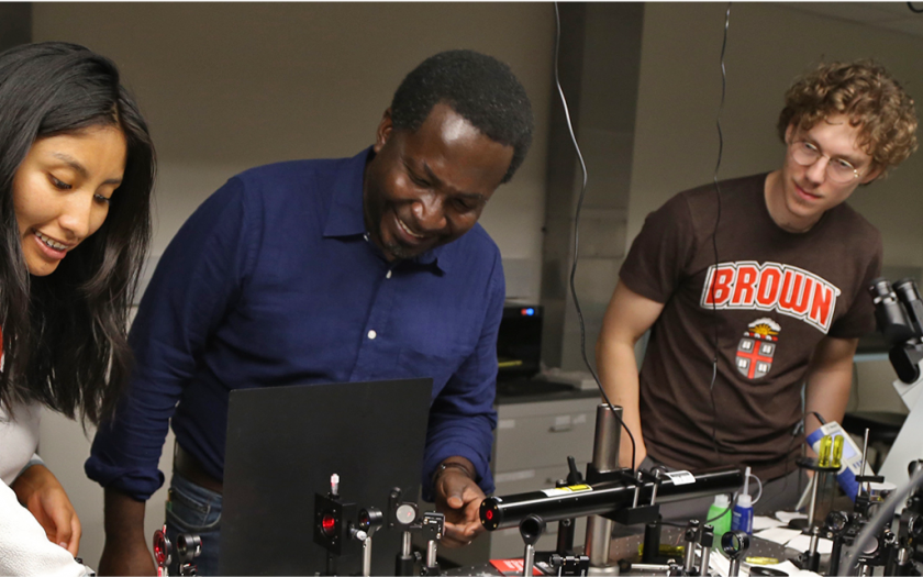 Mitchell Harling with some students in a lab
