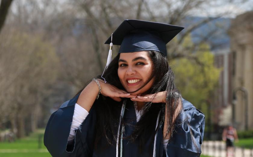 Ramisa Fariha in a graduation gown posing with her hands on her chin