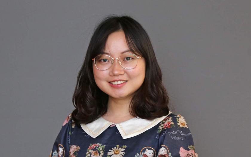 Zixi Lin portrait with a gray background
