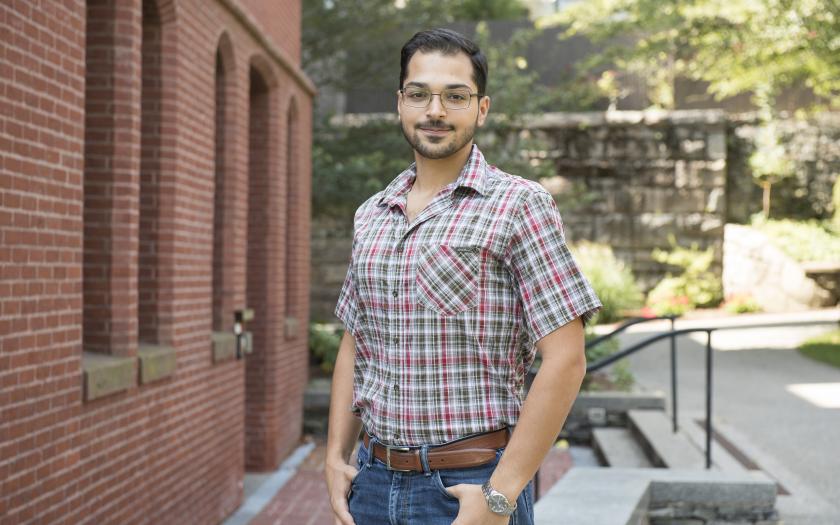 Bardiya Akhbari posing for a photo on campus
