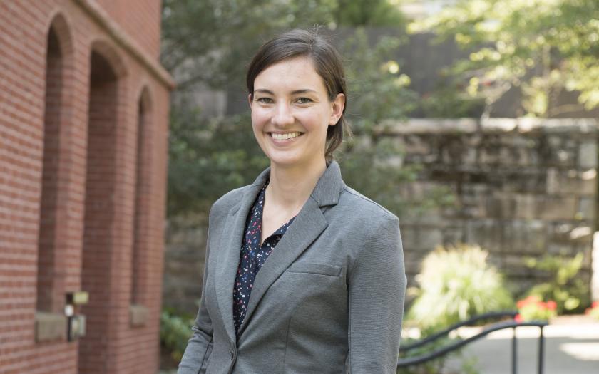 Elaina Atherton portrait in front of a brick building
