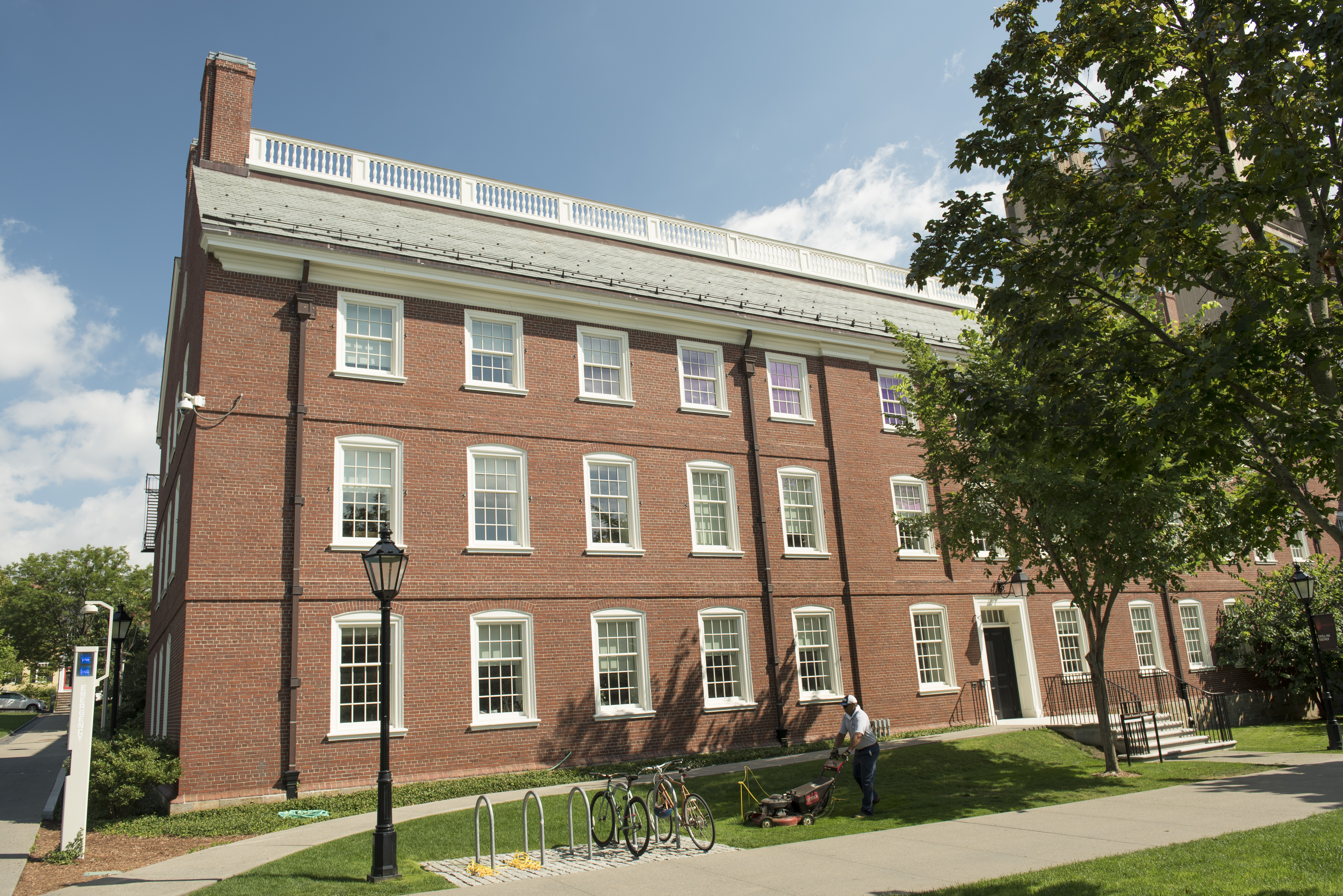classic brick building on a green lawn