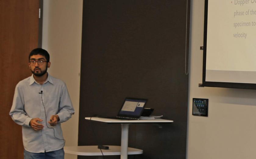 Adil Akif presenting in a classroom