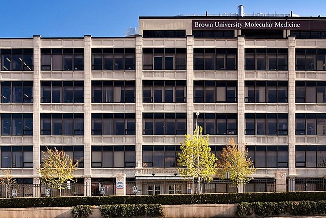 large concrete structure with large grid of multiple windows
